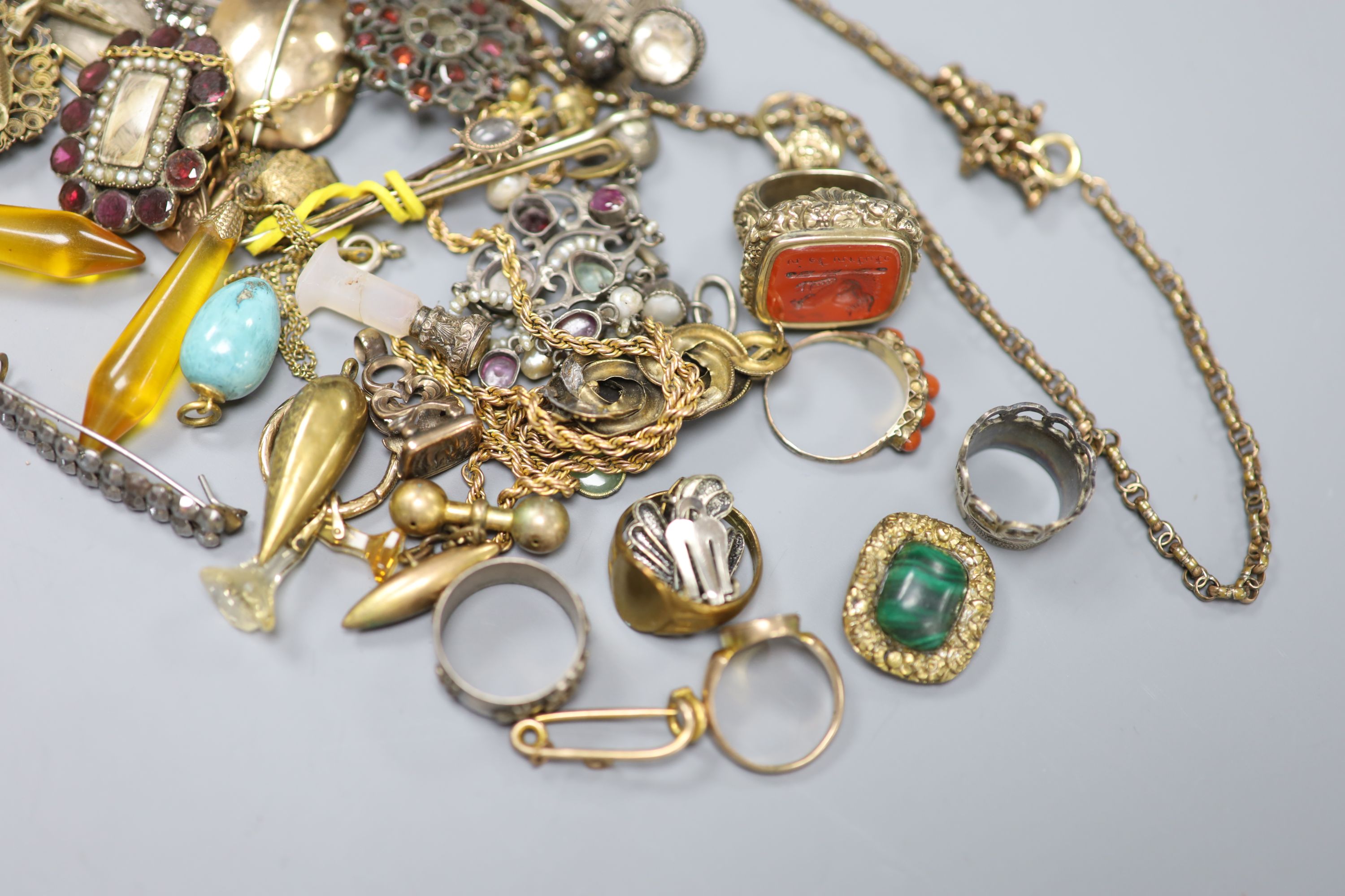A quantity of assorted mainly 19th century jewellery including mourning brooches, fob seal, stick pins, etc.